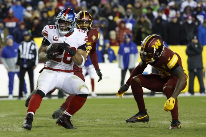 New York Giants running back Saquon Barkley prompts a challenge for the Washington Commanders.